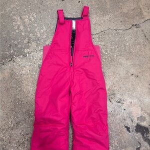 Arctix Kids snow pants in Bright Pink